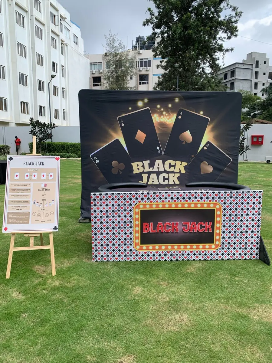 Blackjack station with themed backdrop and rules board
