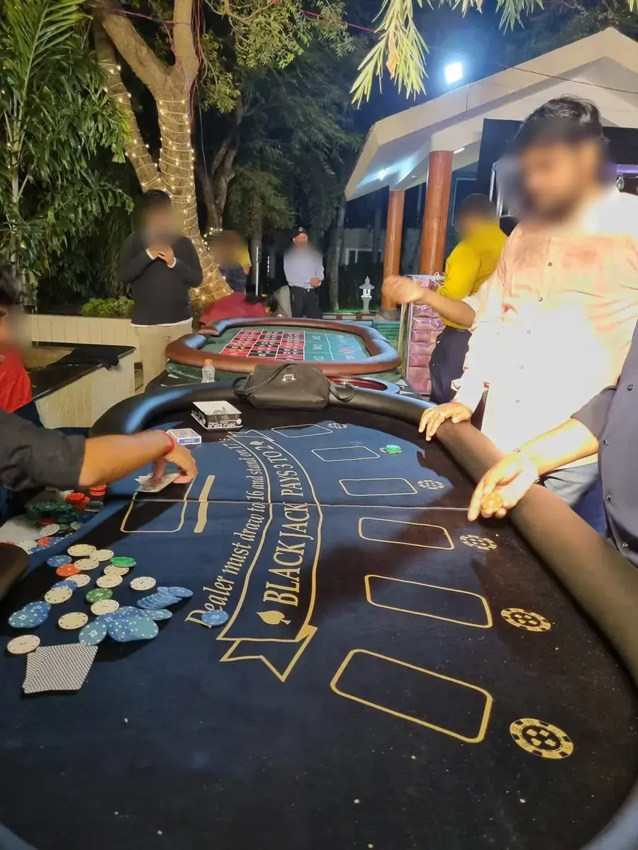 Dealer running a blackjack table at an outdoor party
