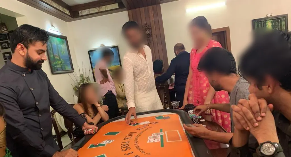 Guests playing blackjack at a private party