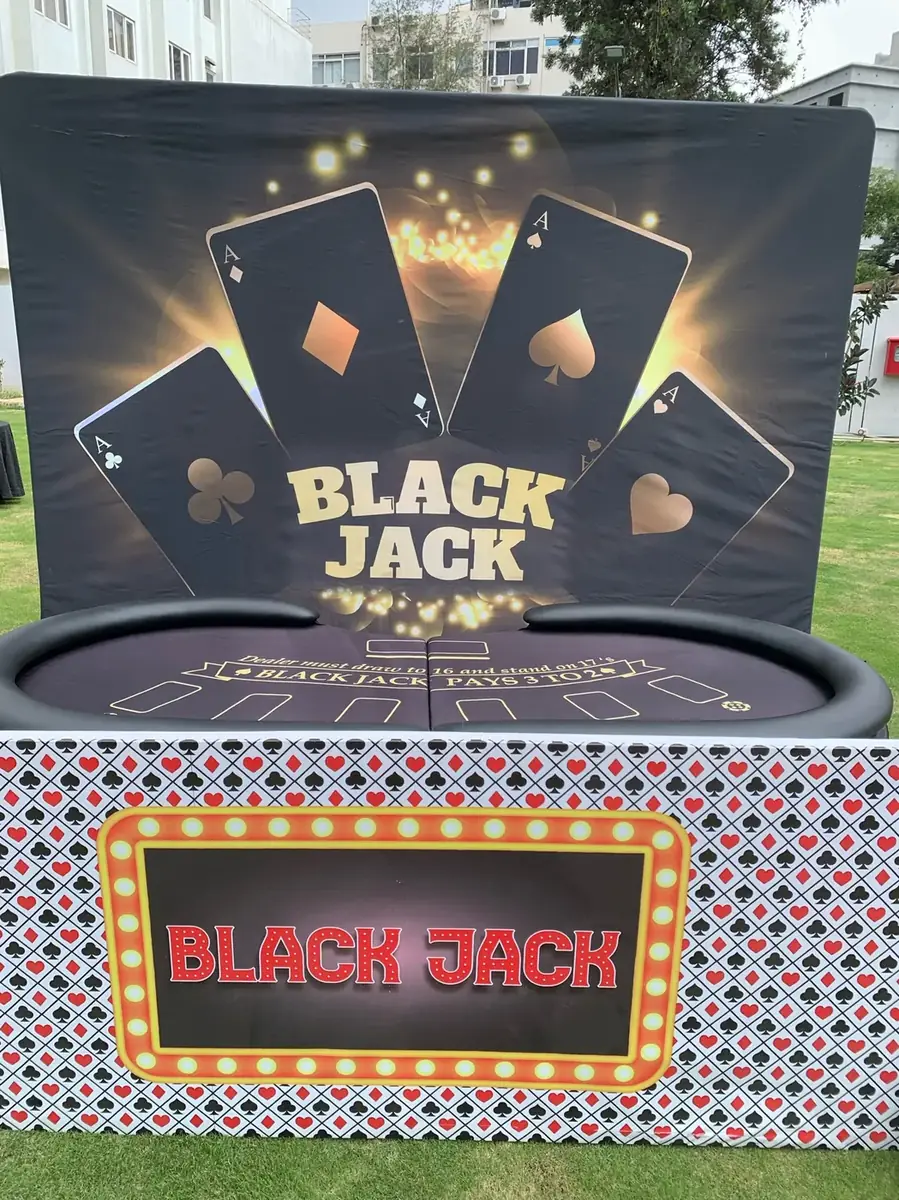 Blackjack station with themed backdrop on a lawn