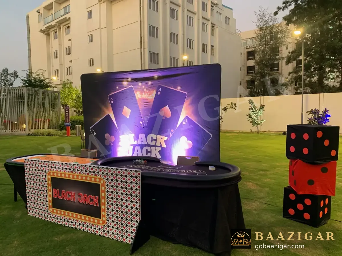 Casino floor on a lawn with roulette and blackjack stations