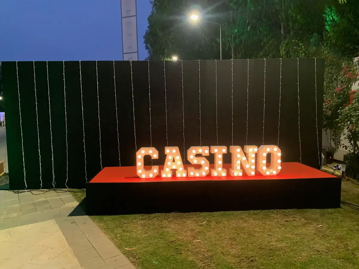 Light-up CASINO marquee letters at an evening event