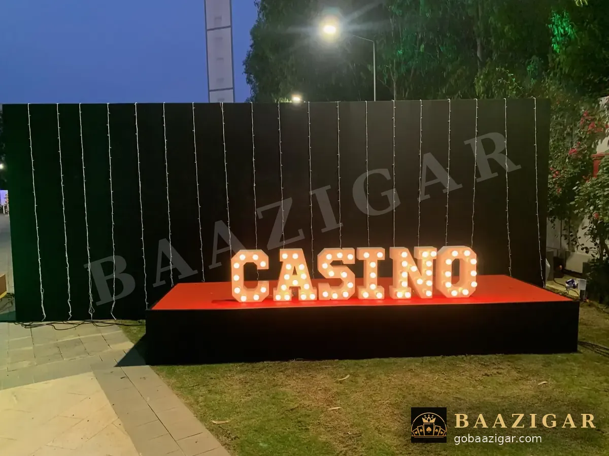 Light-up CASINO marquee letters at an evening event