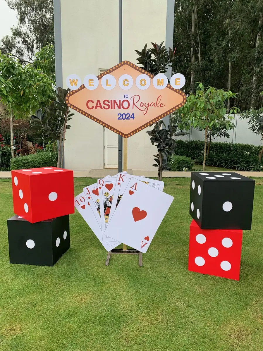 Casino Royale welcome sign with giant dice and playing cards