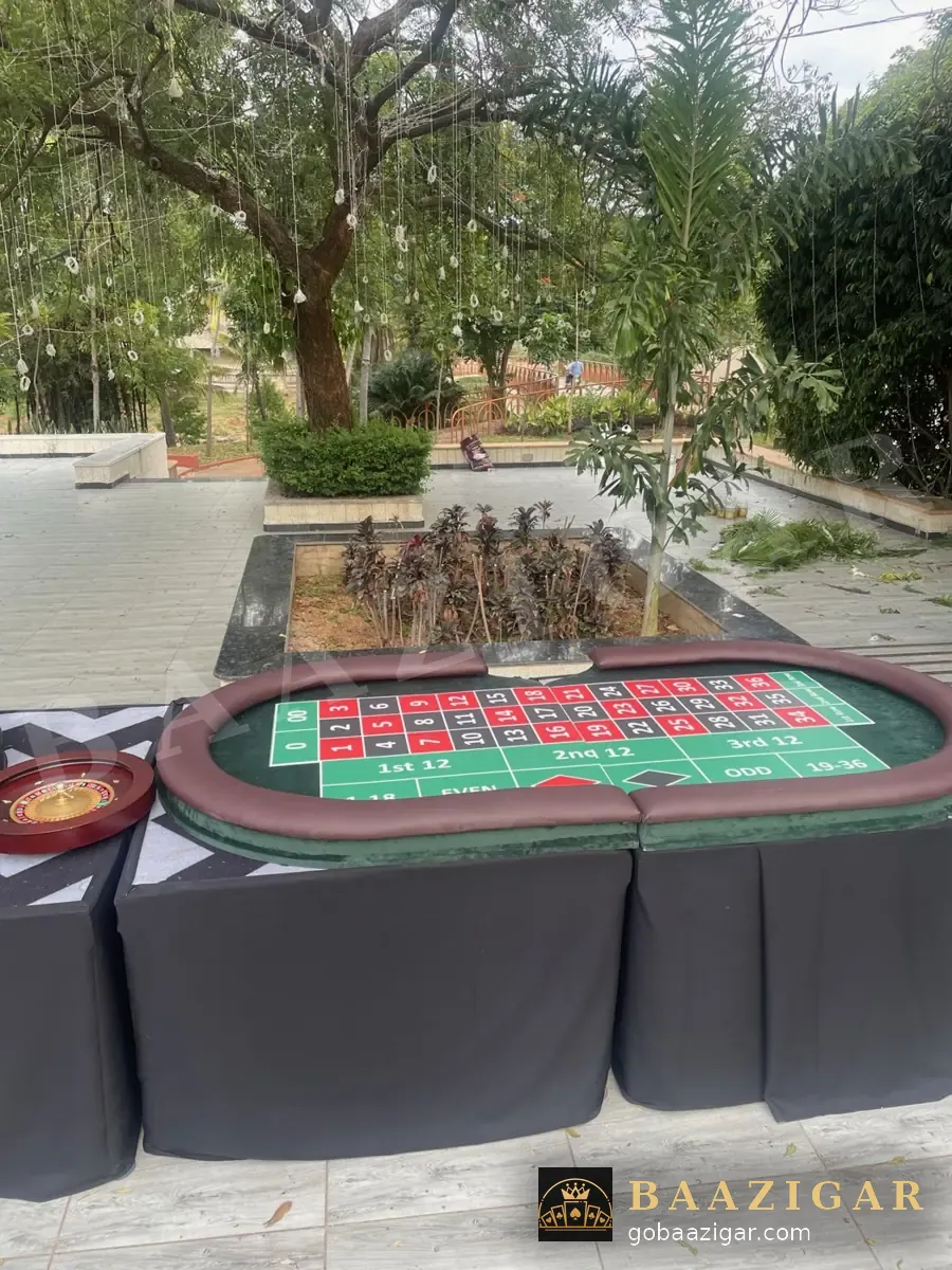 Roulette table set up by a garden pool