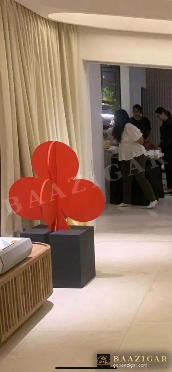 Giant club-suit décor at a house party entrance