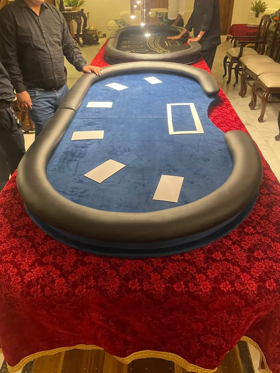 Poker and blackjack tables set up in a home dining room