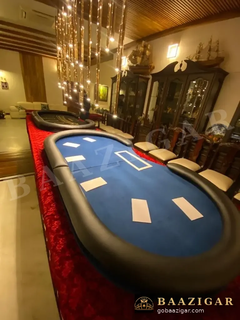 Poker table under a chandelier in a living room