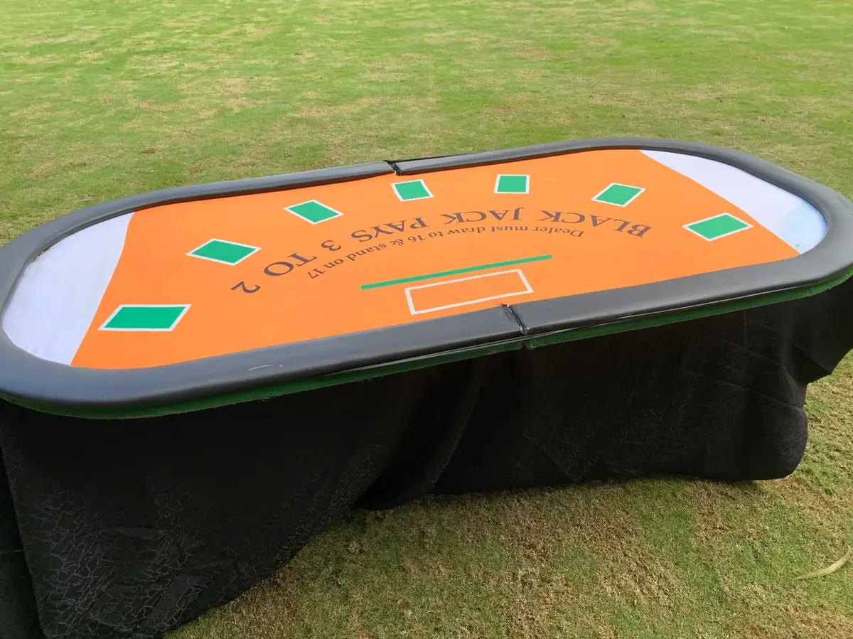 Blackjack table set up outdoors on a lawn