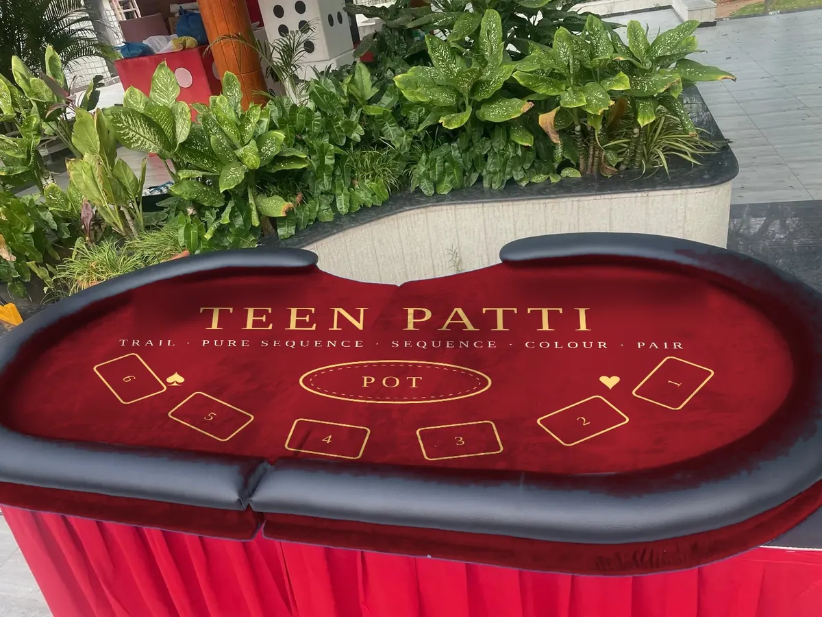Teen Patti felt design shown on a Baazigar table
