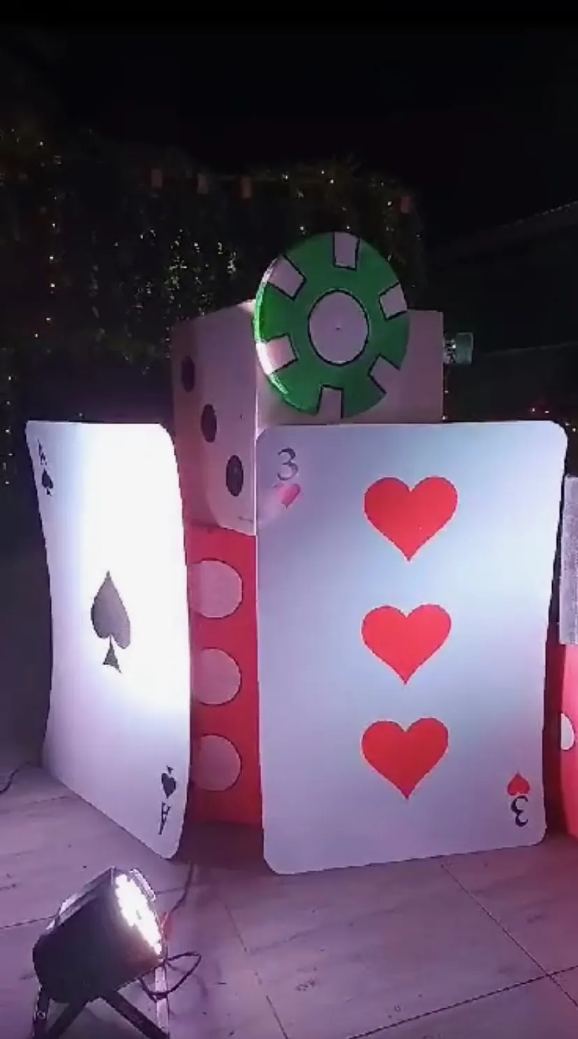 Giant playing cards and dice décor at a wedding