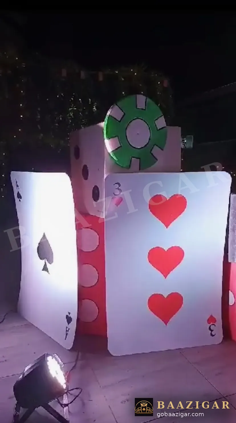Giant playing cards and dice décor at a wedding