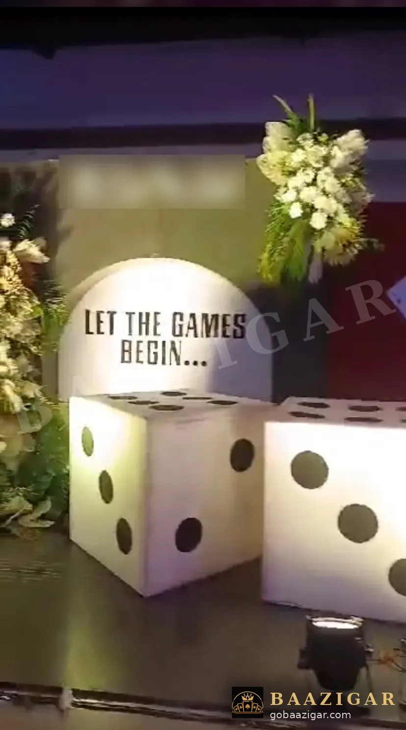 Let the games begin sign with giant dice at a wedding