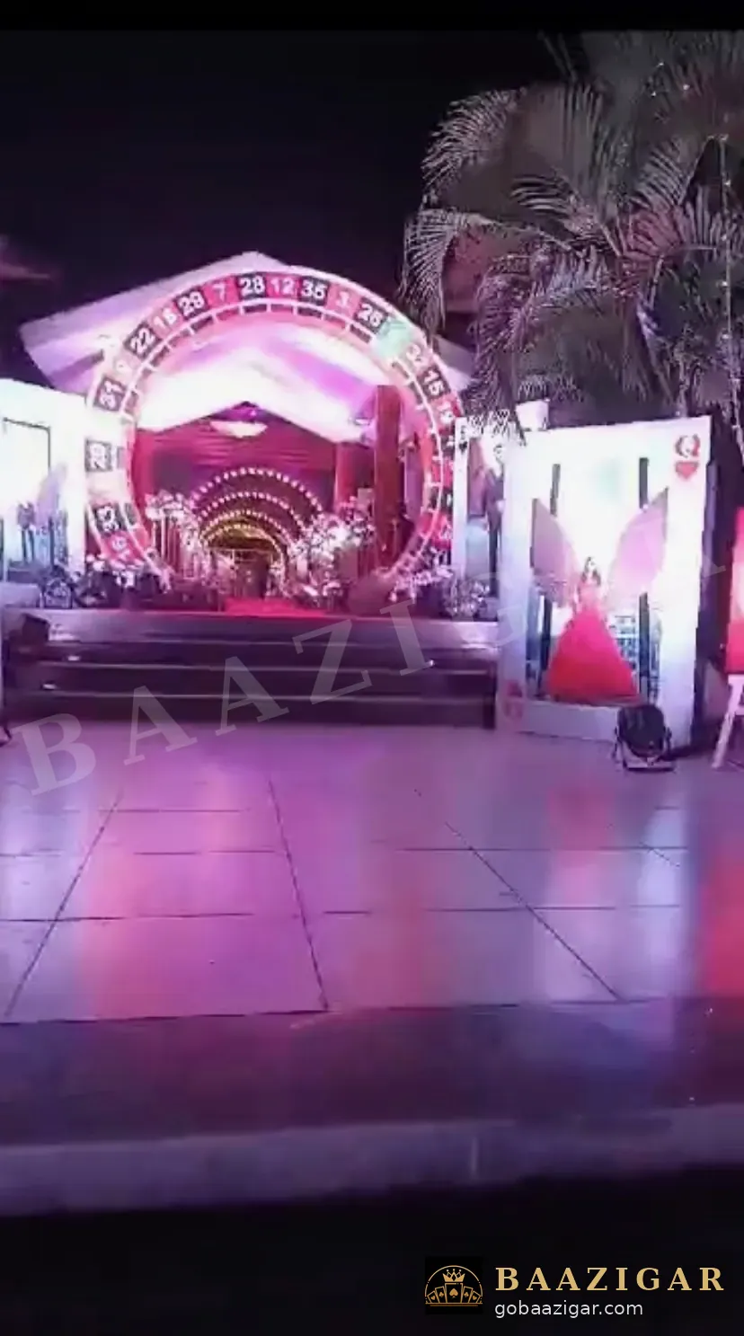 Casino-themed wedding stage with a roulette arch
